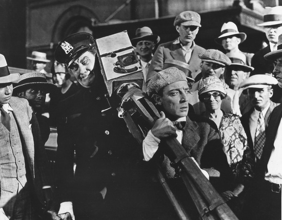 Buster Keaton in THE CAMERAMAN emulates real life newspaper photogs trying to get a scoop.