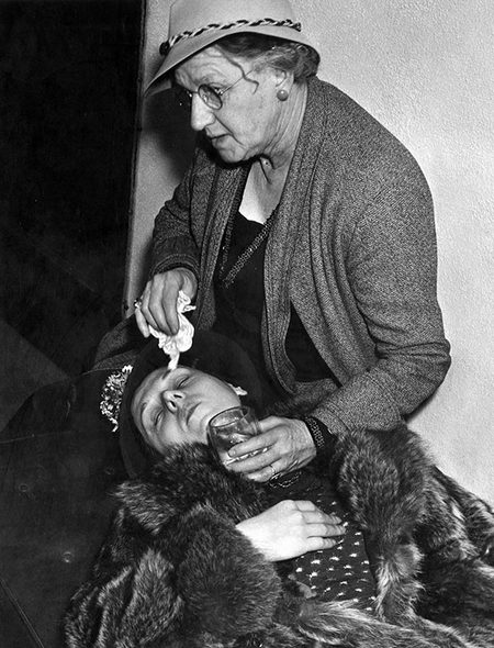 Helen, passed out in her mother's arms. Photo courtesy LAPL.