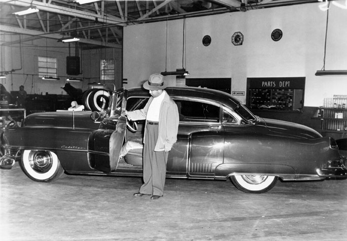 Mickey Cohen and his bullet proof car.